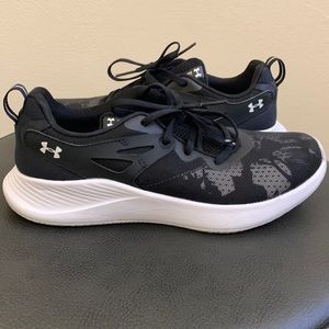 Black and white Under Armour shoes.